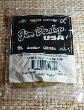 Dunlop® 433 Ultex® Sharp Uñetas Calibre: 1.14mm Miel | Bolsa:  36 Unidades